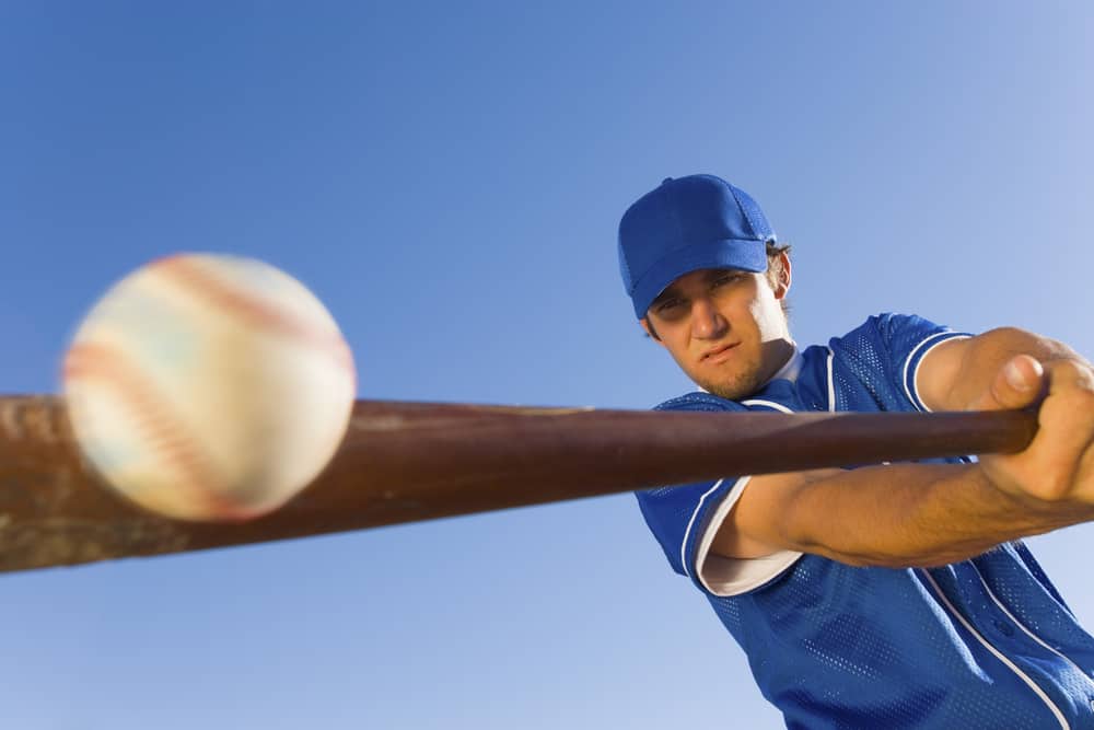 Batter hitting a baseball